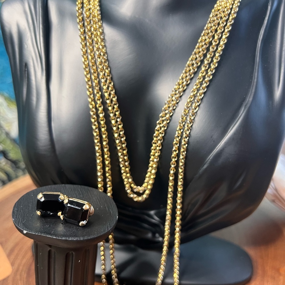 Matching 45 inch gold chain necklace with black onyx clip on earrings.